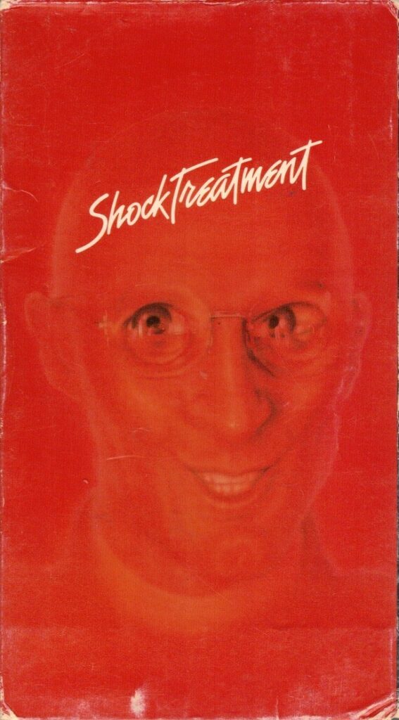 Shock Treatment VHS box cover front. Video starring Jessica Harper, Cliff De Young. With Patricia Quinn, Richard O'Brien, Charles Gray, Ruby Wax, Nell Campbell, Rik Mayall, Barry Humphries. Directed by Jim Sharman. 1981.